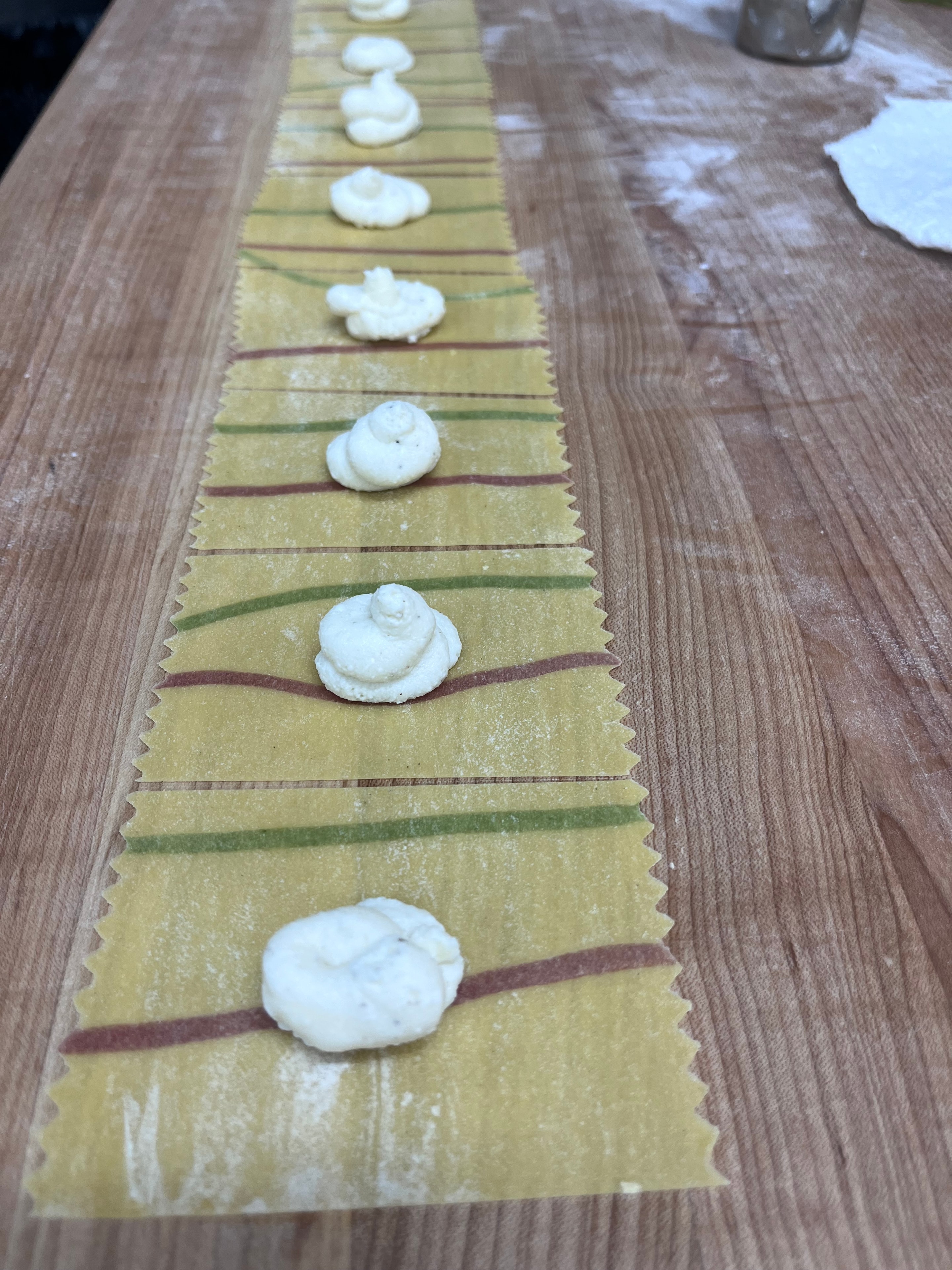 Handmade sunflower ravioli on a floured surface