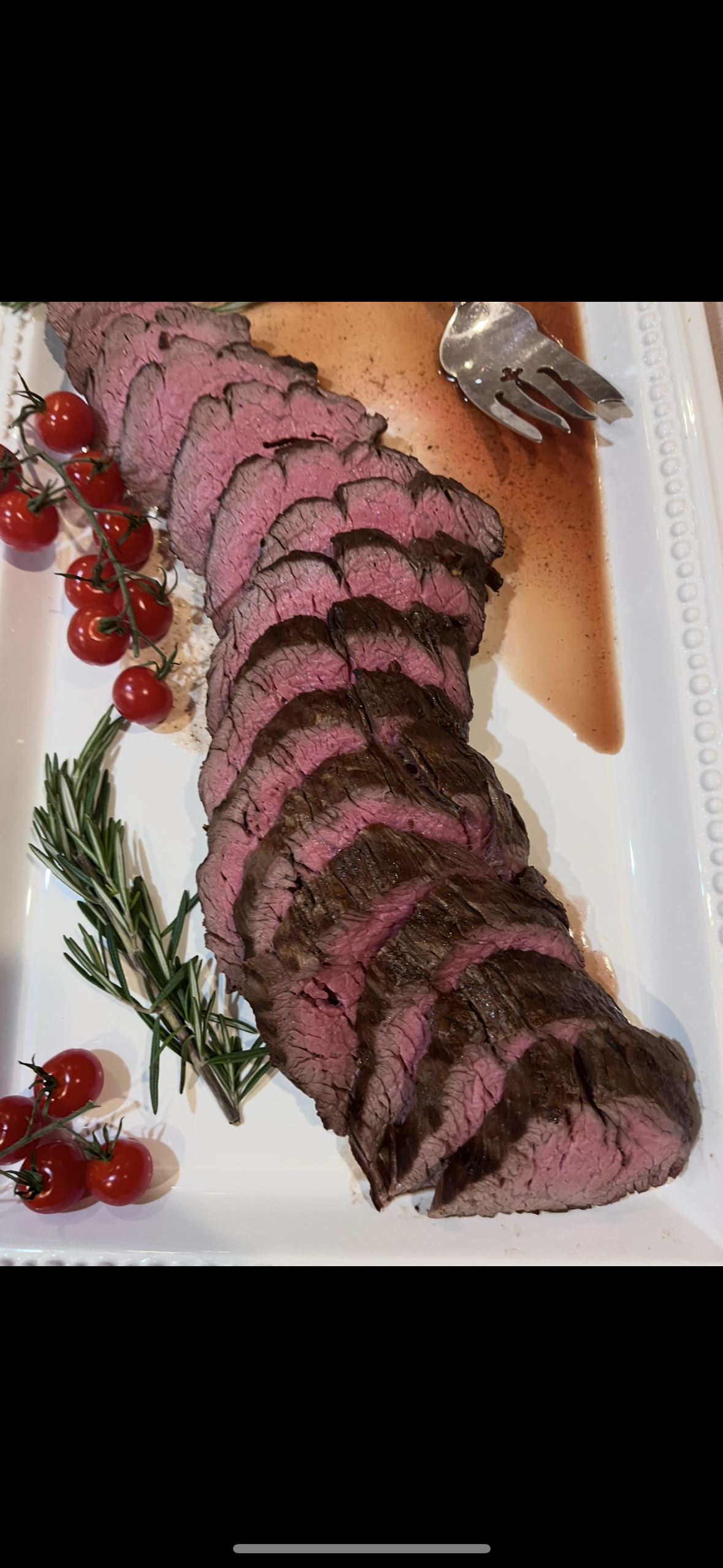 Sliced rare beef roast with garnish